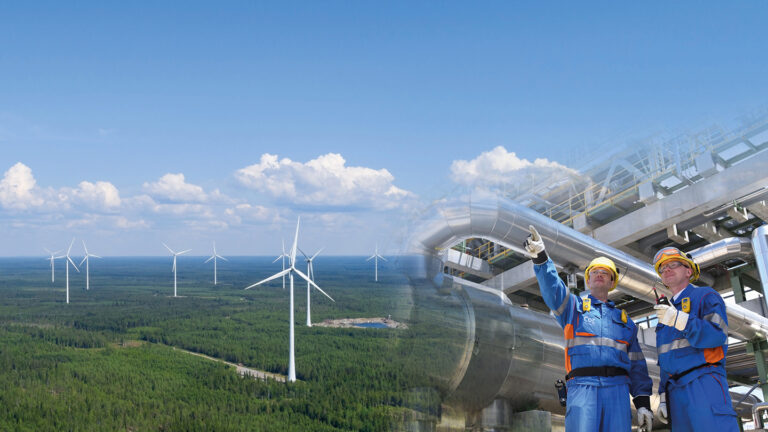 Two pictures merged into one. In the other picture, there is a wind farm photographed from the air on a sunny day. The second picture shows two employees standing next to each other at a plant.