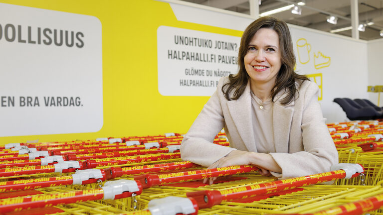 HalpaHalli’s Communications Manager Mari Emmes pictured in one of the company’s stores next to shopping carts.