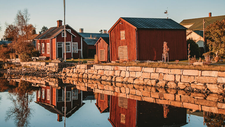 Old wooden houses by the water.