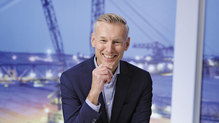 Nordic Lights’ CEO Tom Nordström with a construction site in the background.