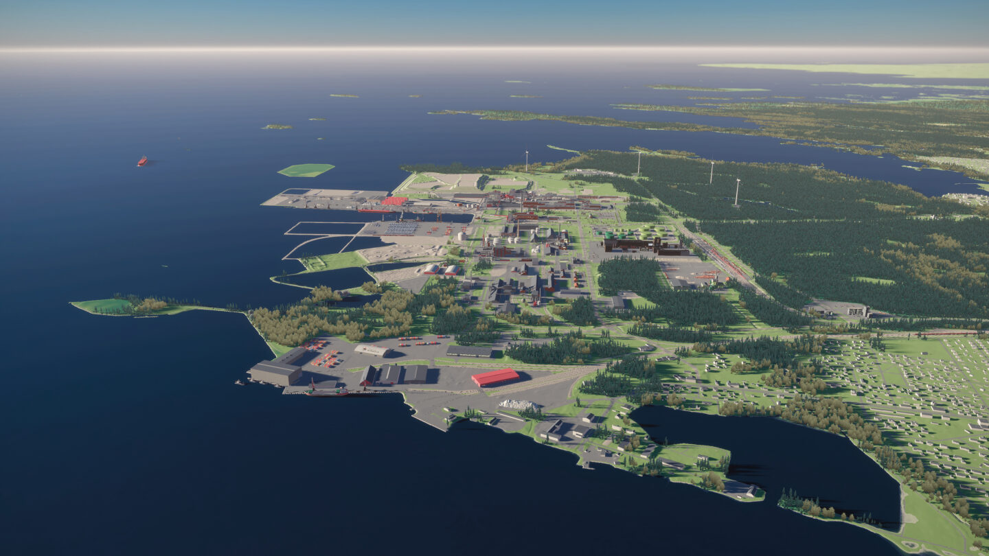 The Kokkola Industrial Park pictured from high above by the sea. There are multiple buildings and a forest.