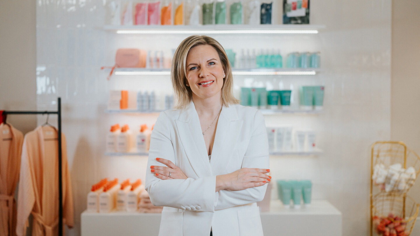 Suvi Markko pictured in Dermosil store with products in the background.