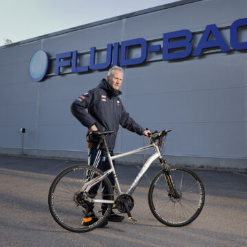 Tommy Haglund pictured in front of Fluid-Bag's facility with his bike.