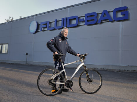 Tommy Haglund pictured in front of Fluid-Bag's facility with his bike.