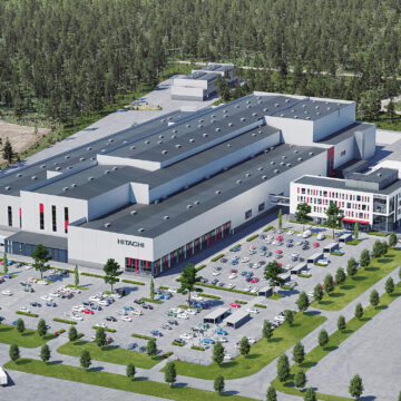 An illustration of the future Hitachi Energy Park. The facility is shown from high above with a lot of cars in its parking lot.