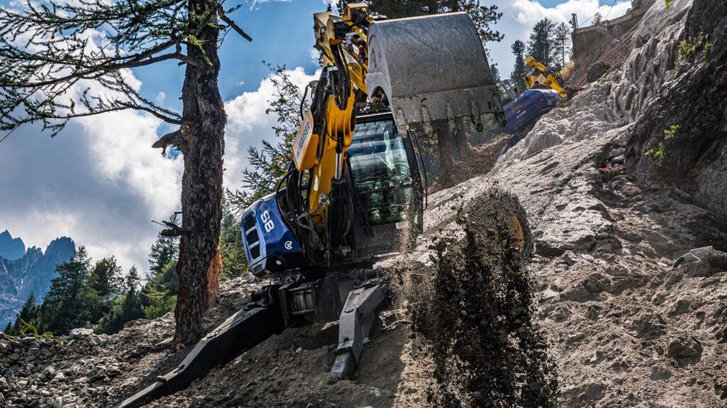 A worker using a mobile walking excavator.