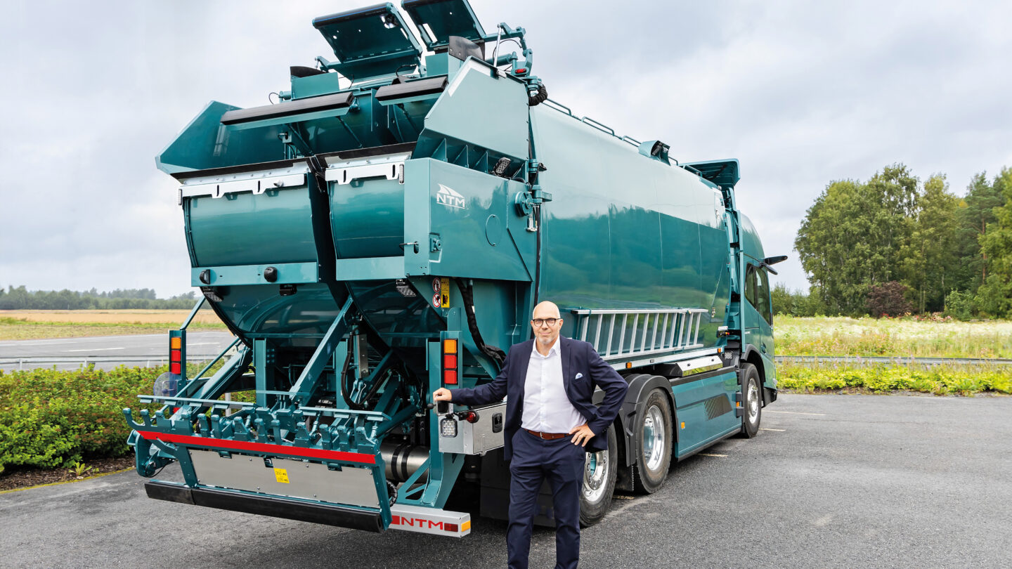 Niclas Pada pictured in front of a refuse collection vehicle.